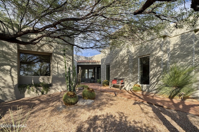 back of property featuring a patio