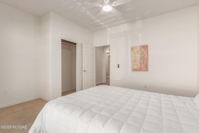 carpeted bedroom featuring ceiling fan and a closet