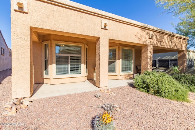 rear view of house with a patio