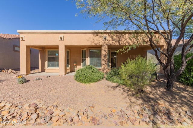 rear view of house with a patio