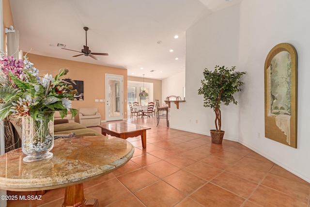 interior space featuring ceiling fan and tile patterned floors