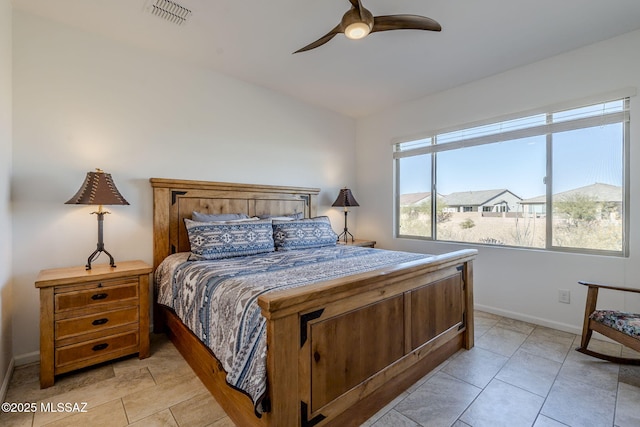 bedroom featuring light tile patterned floors and ceiling fan