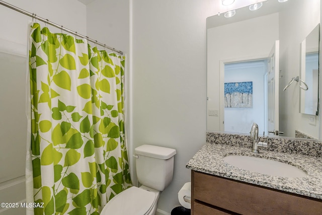 bathroom with toilet and vanity