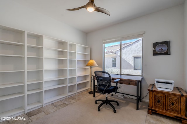 carpeted home office with ceiling fan