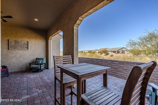 view of patio featuring ceiling fan