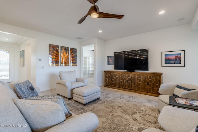 tiled living room with ceiling fan