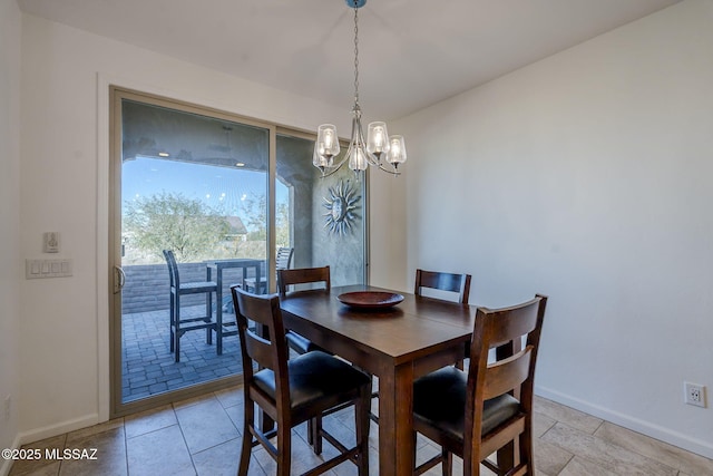 dining area with a notable chandelier and light tile patterned floors