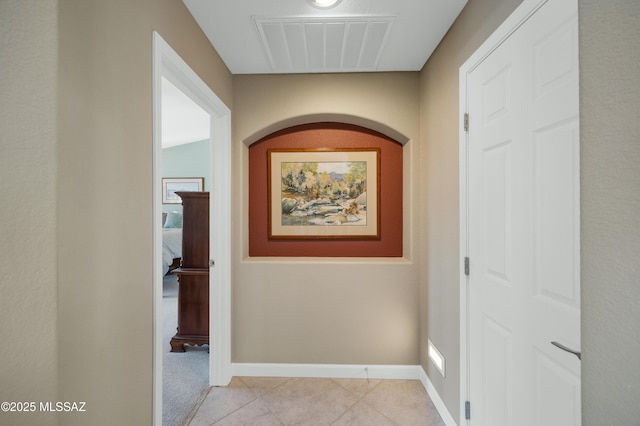 corridor with light tile patterned floors