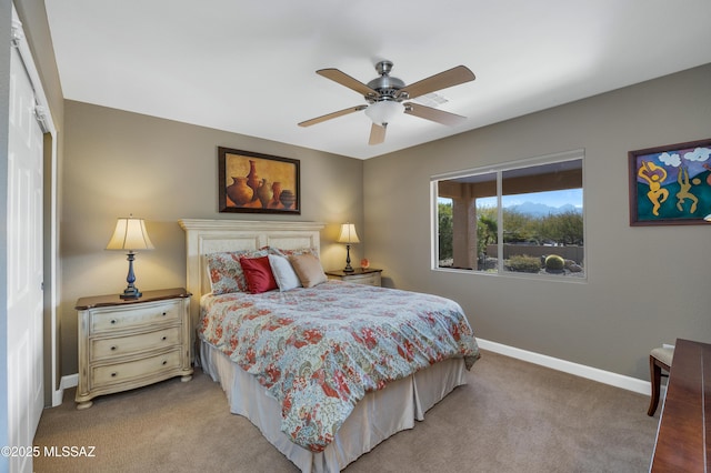 carpeted bedroom with ceiling fan