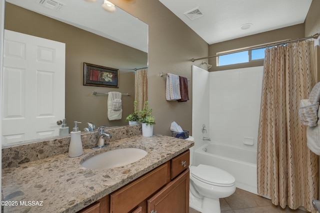 full bathroom with vanity, toilet, tile patterned flooring, and shower / bath combo