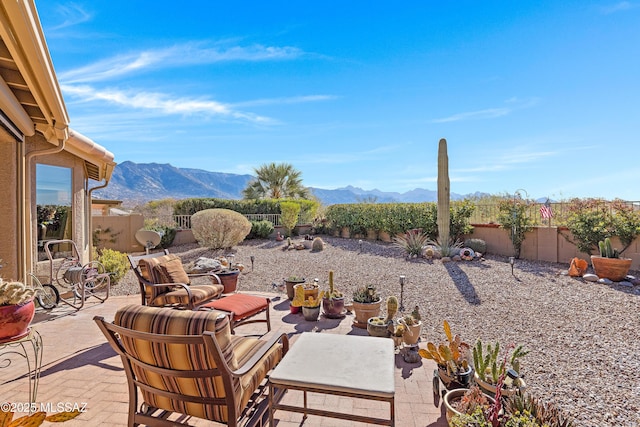 view of patio / terrace featuring a mountain view