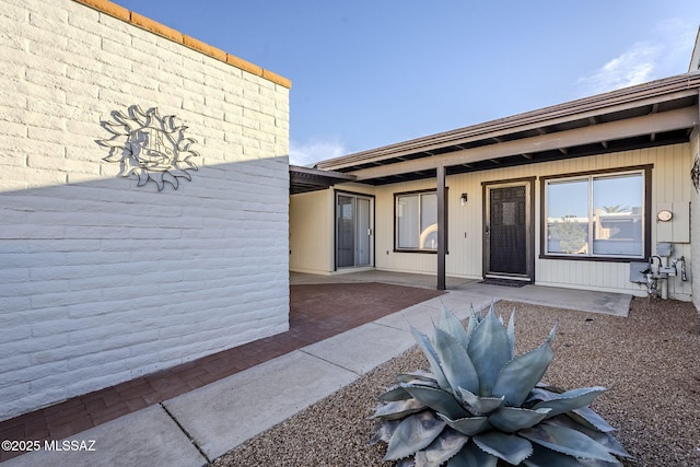 doorway to property featuring a patio