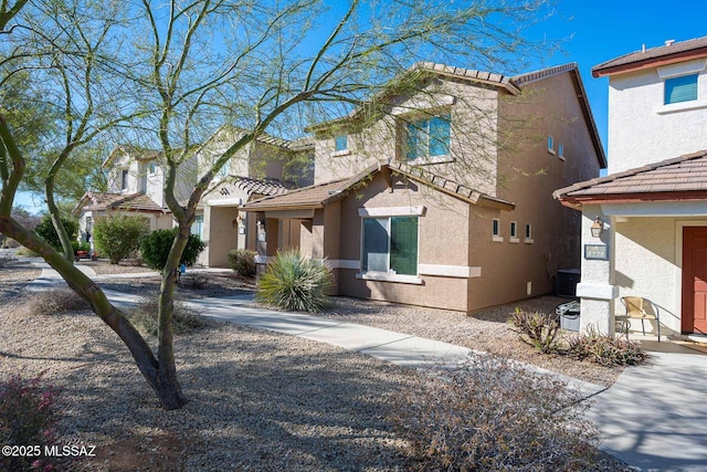 view of front of property featuring cooling unit