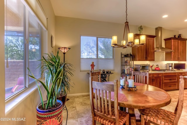 dining area with an inviting chandelier