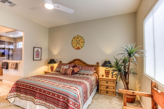 bedroom featuring ceiling fan and light colored carpet