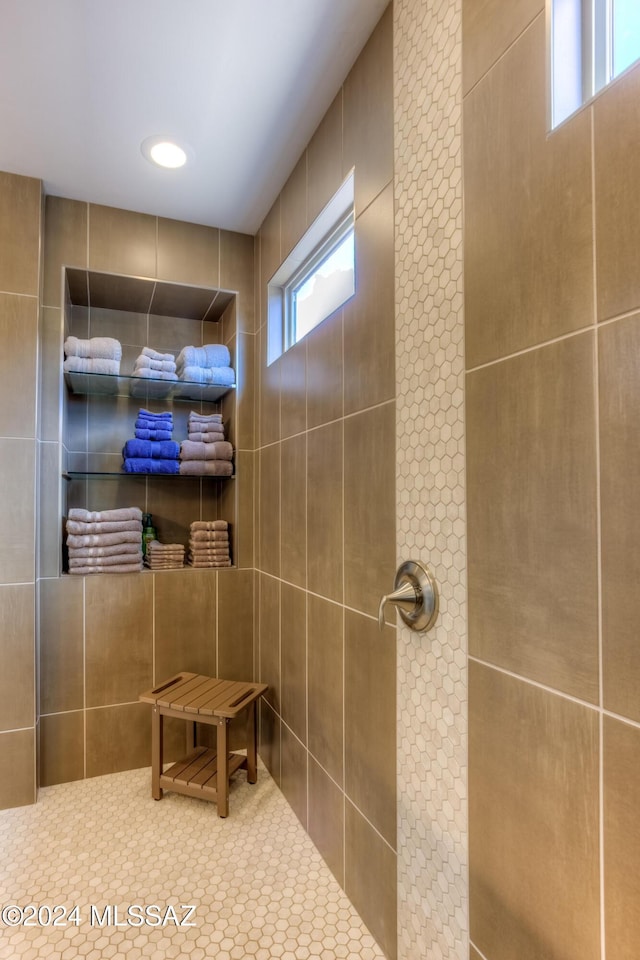 bathroom with tiled shower