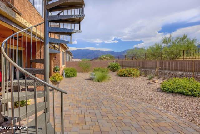 view of patio / terrace featuring a mountain view