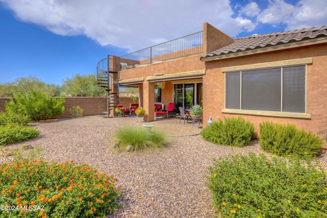 back of property with a patio area