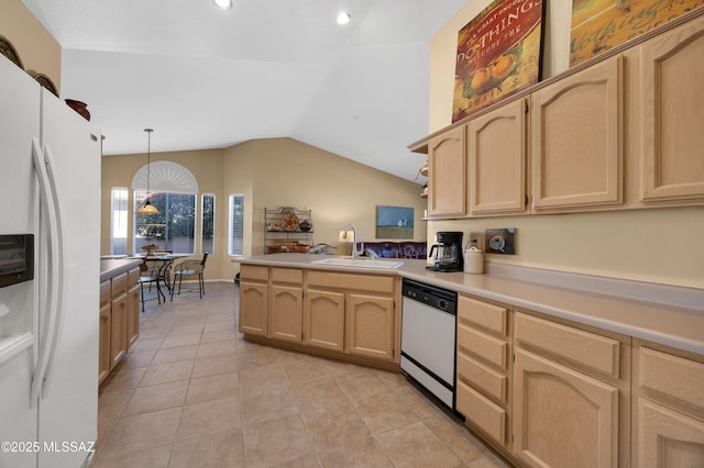 kitchen featuring hanging light fixtures, dishwashing machine, white fridge with ice dispenser, and light brown cabinets