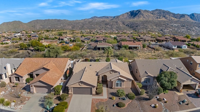 birds eye view of property with a mountain view