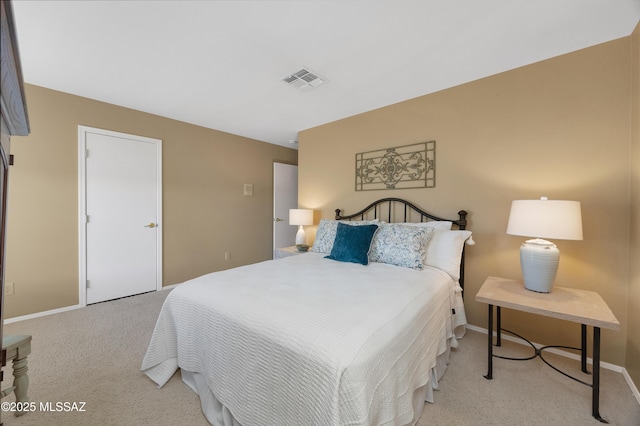 bedroom with light colored carpet