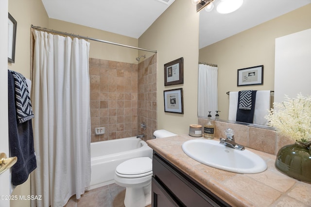 full bathroom with tile patterned flooring, toilet, vanity, and shower / bath combination with curtain