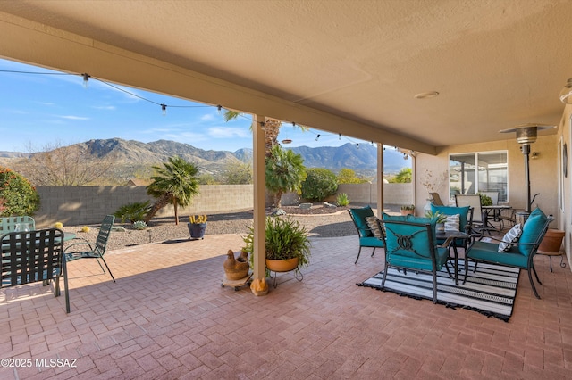 view of patio / terrace featuring a mountain view