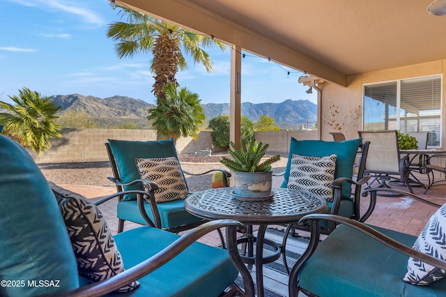 view of patio / terrace featuring a mountain view