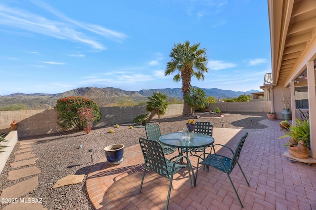 view of patio / terrace with a mountain view