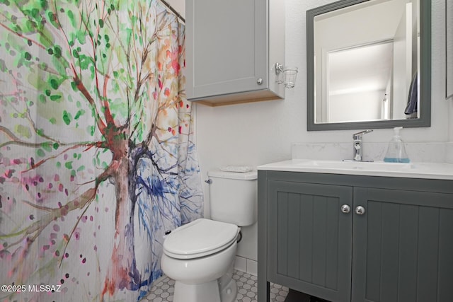 bathroom with toilet and vanity