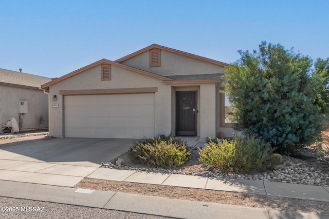 ranch-style house featuring a garage