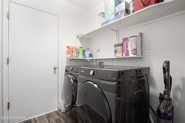 washroom with separate washer and dryer and dark hardwood / wood-style flooring