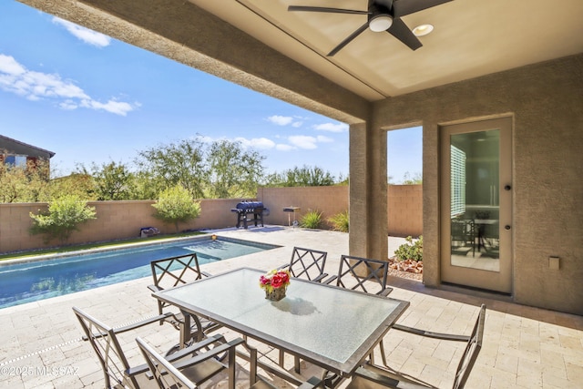 view of pool with a patio area, ceiling fan, and area for grilling