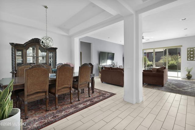 dining room with ceiling fan with notable chandelier