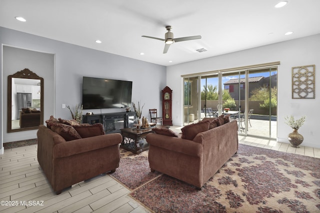 living room featuring ceiling fan