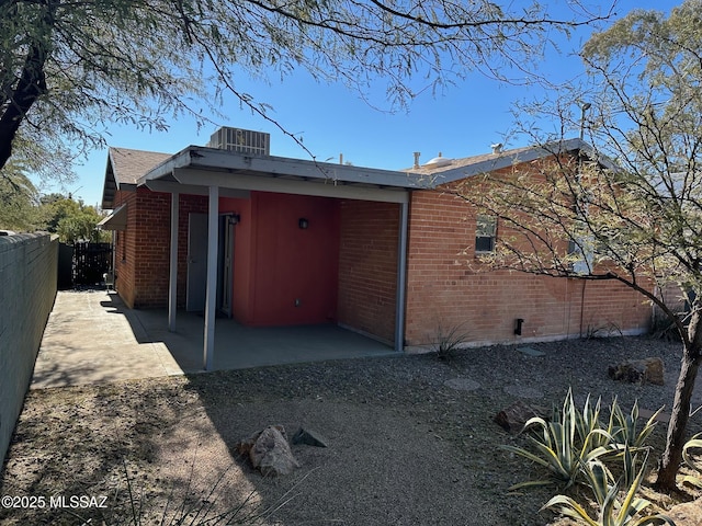 back of property with a patio