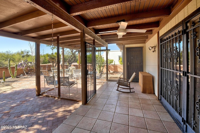 view of patio / terrace featuring ceiling fan and french doors