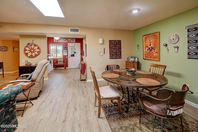 dining room with light hardwood / wood-style floors