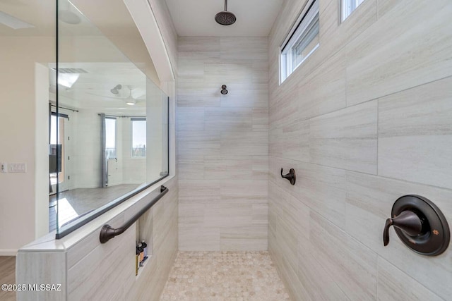 bathroom featuring tiled shower