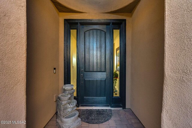 hall featuring light hardwood / wood-style floors and a tray ceiling