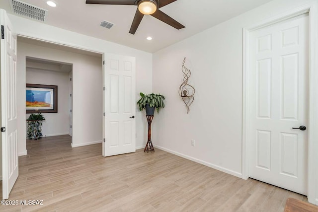 unfurnished bedroom featuring recessed lighting, baseboards, visible vents, and light wood finished floors