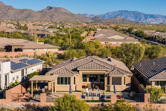 exterior space with a residential view and a mountain view