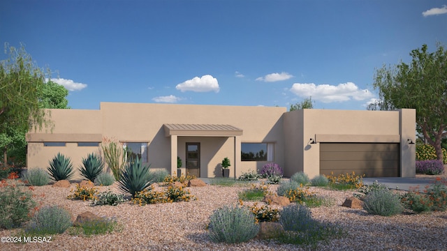 pueblo-style house with a garage