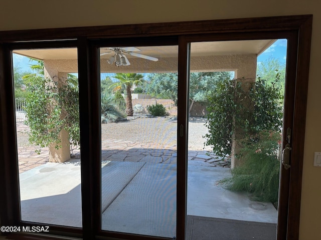 doorway to outside with ceiling fan