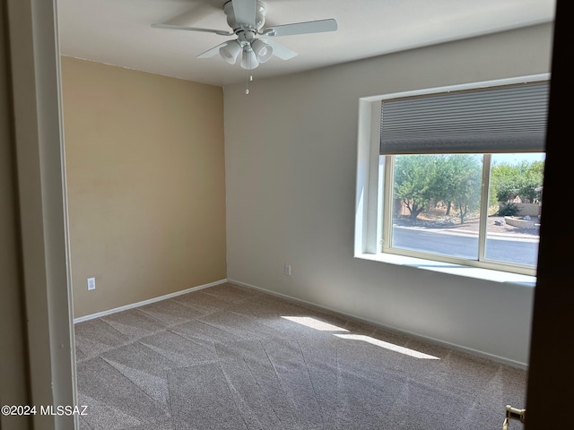 carpeted empty room with ceiling fan