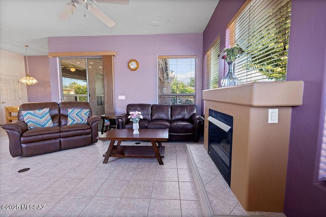 tiled living room with ceiling fan