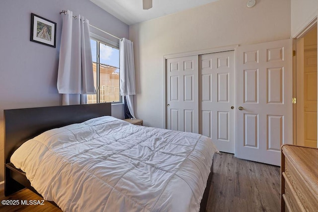 bedroom featuring a closet, ceiling fan, and hardwood / wood-style floors