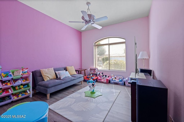 playroom featuring light wood-type flooring and ceiling fan