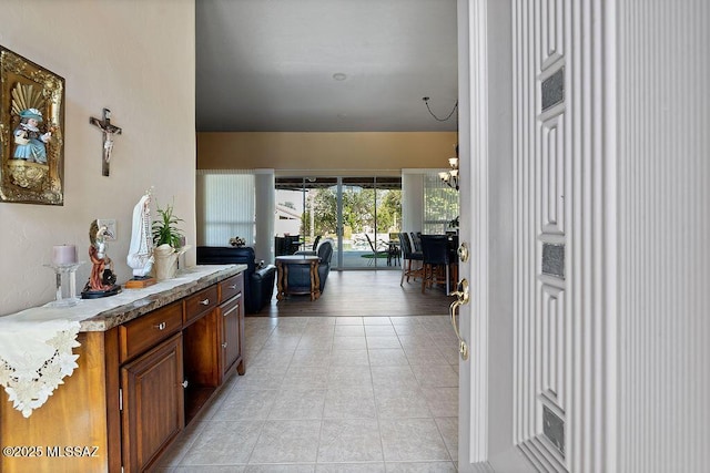 hall featuring light tile patterned floors