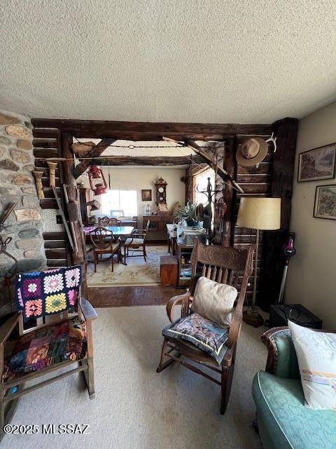 living room with a textured ceiling and beam ceiling